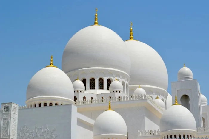 The white domes of the Sheikh Zayed Grand Mosque in Abu Dhabi