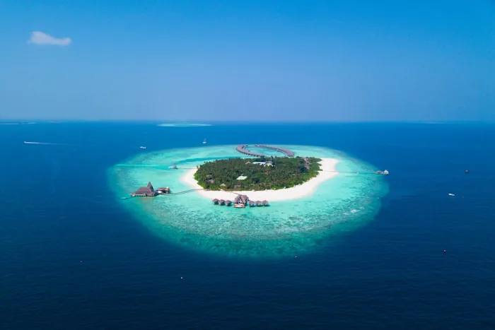 A small island ringed by coral reef in the Fiji islands