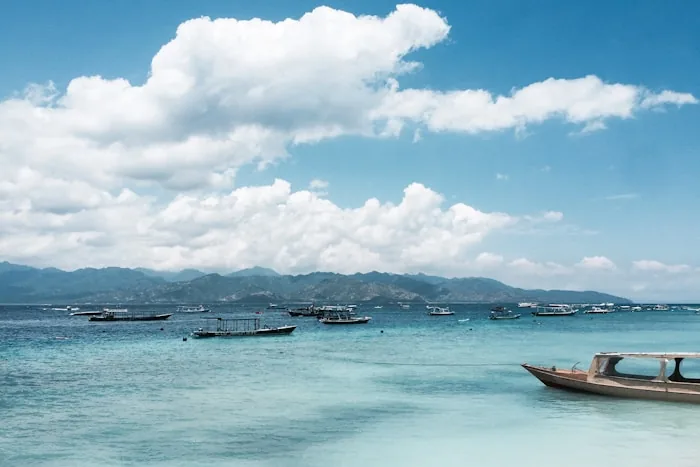 Wooden boats on turquoise water at the Gili Islands
