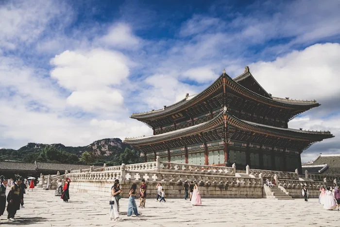 Gyeongbokgung Palace in Seoul with visitors in hanbok