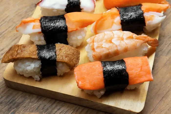 Nigiri sushi on a wooden board