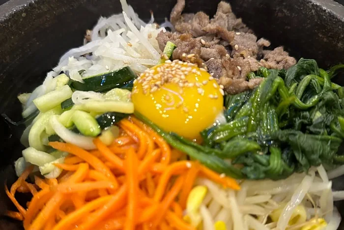 Korean bibimbap served with side dishes