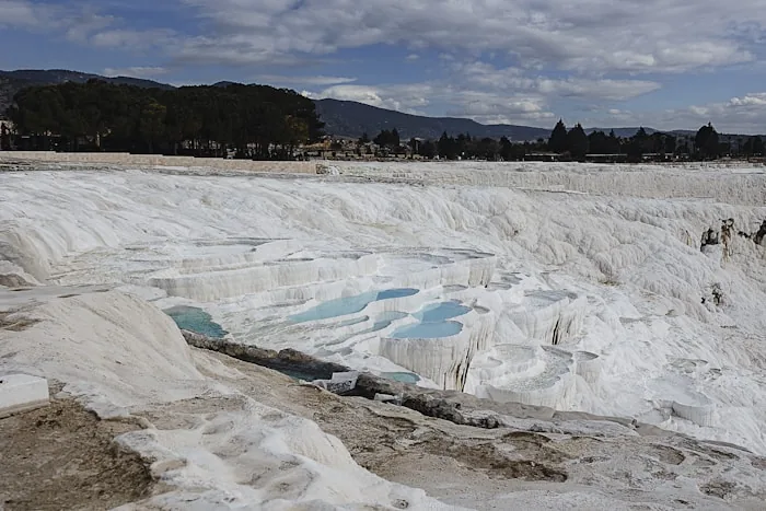 The white mineral terraces and pools at Pamukkale, Turkey